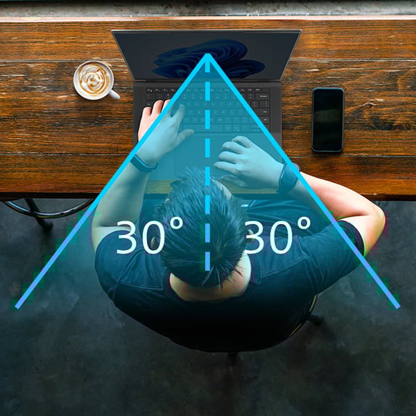Professional working on a laptop with a Kensington privacy screen that includes a privacy focused viewing angle that narrows field of view to +/- 30°.